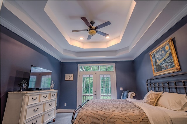 bedroom with carpet, access to outside, ceiling fan, a raised ceiling, and french doors