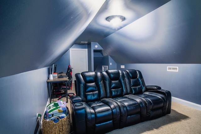 cinema room featuring carpet and lofted ceiling