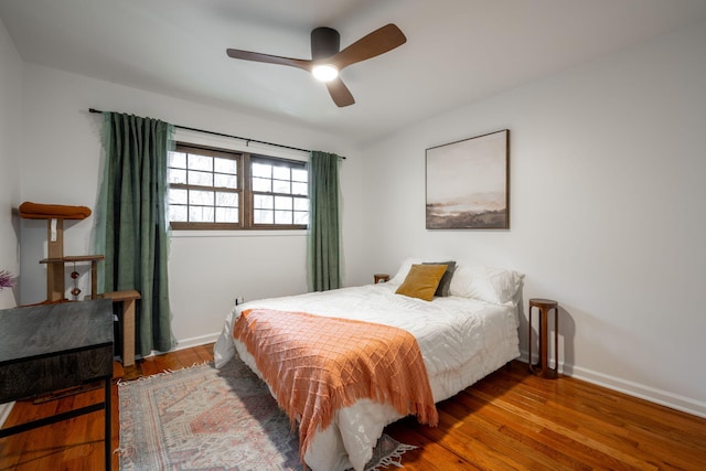 bedroom with hardwood / wood-style flooring and ceiling fan