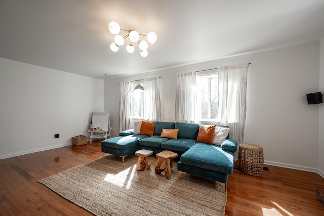 living room featuring hardwood / wood-style floors and a notable chandelier