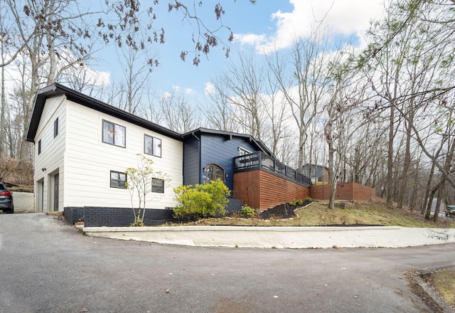 view of side of home with a garage