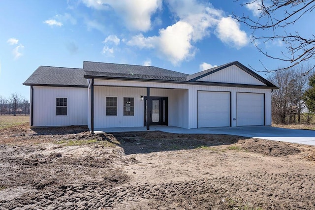 view of front facade with a garage and covered porch