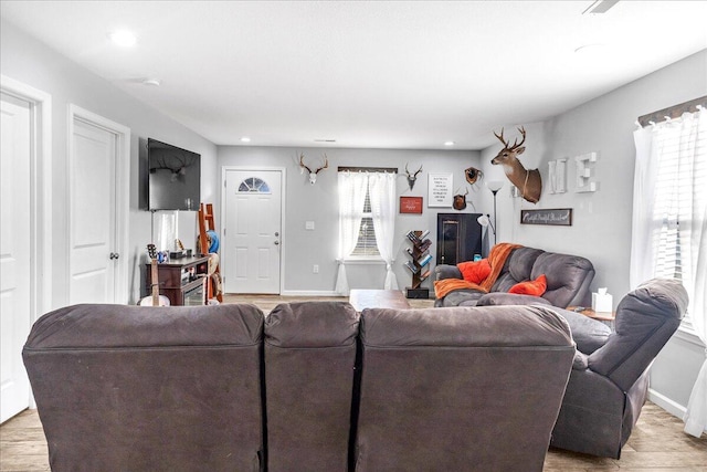 living room with light hardwood / wood-style flooring