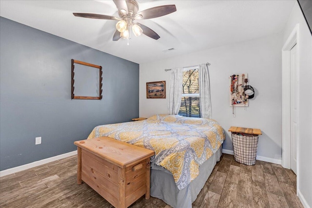 bedroom with ceiling fan and hardwood / wood-style floors