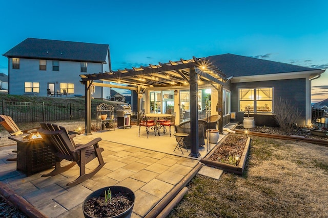 view of patio / terrace featuring a fire pit, fence, and a pergola