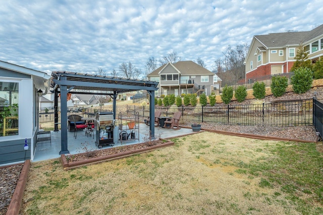 view of yard with a residential view, a patio area, and fence