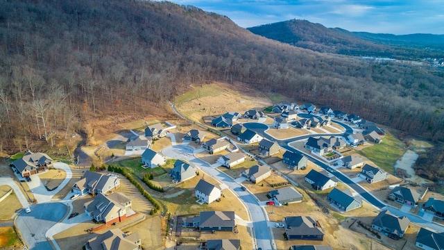 aerial view with a forest view, a residential view, and a mountain view