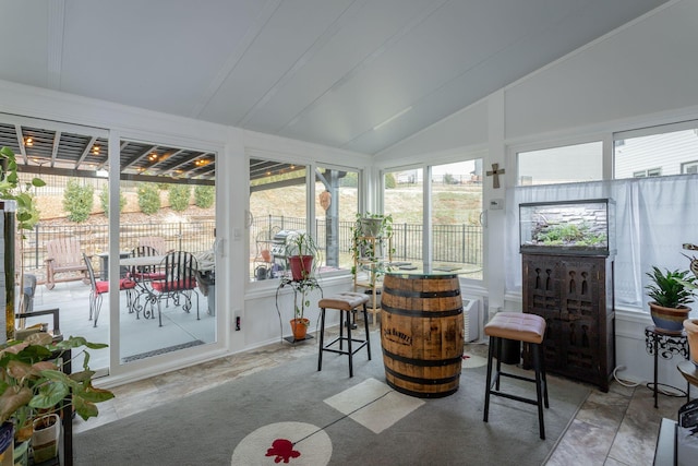 sunroom / solarium with lofted ceiling