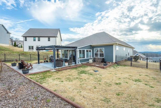 rear view of house with a fenced backyard, a patio, a lawn, and a pergola