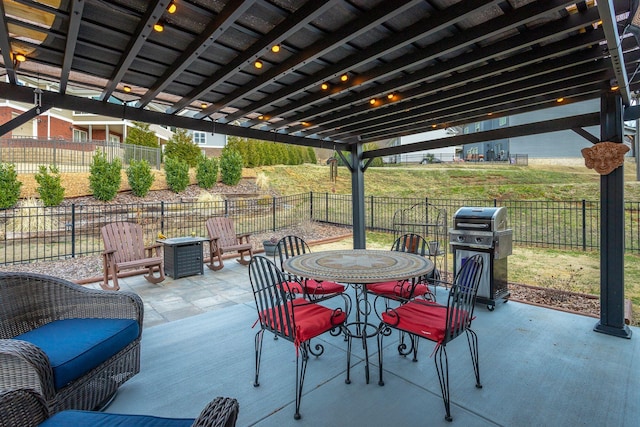 view of patio / terrace with a fenced backyard, grilling area, and outdoor dining space