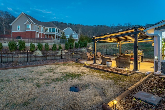 view of yard with a patio area, fence, and a pergola