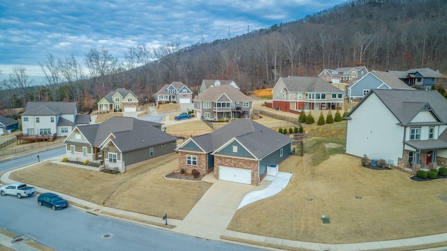 bird's eye view featuring a residential view and a view of trees