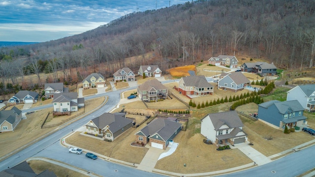 birds eye view of property with a residential view and a view of trees