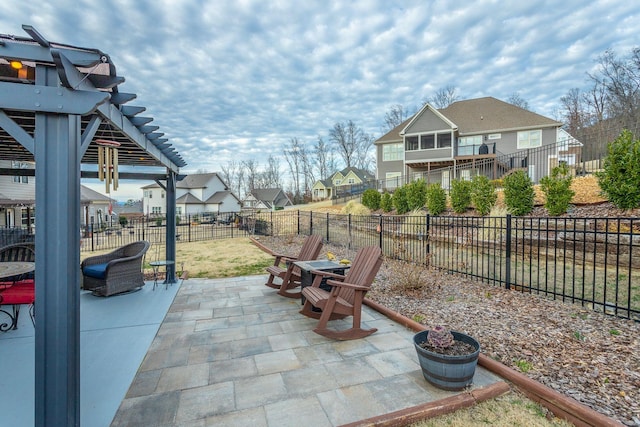 view of patio / terrace featuring a fenced backyard, a residential view, and a pergola