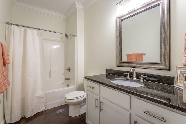 bathroom with toilet, wood finished floors, vanity, shower / bath combo with shower curtain, and crown molding