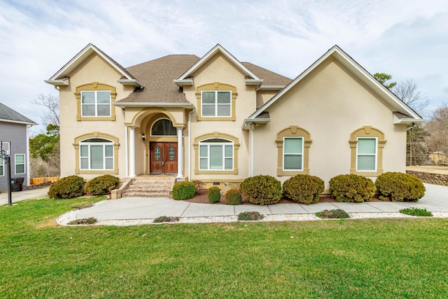 view of front of property with a front lawn and french doors