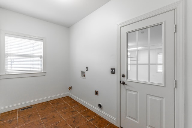 clothes washing area with washer hookup and electric dryer hookup