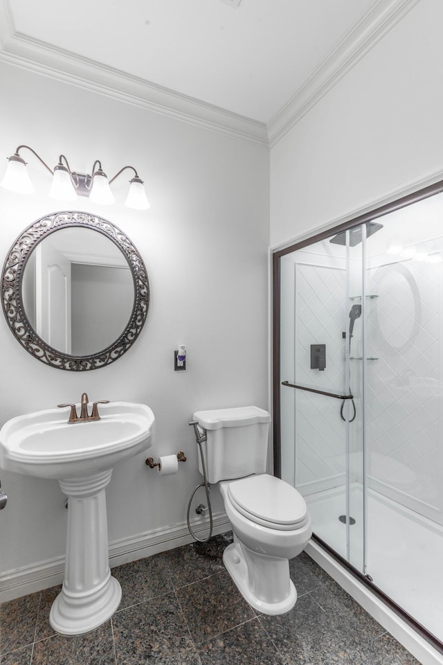 bathroom with ornamental molding, toilet, and an enclosed shower