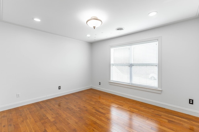 spare room featuring hardwood / wood-style floors