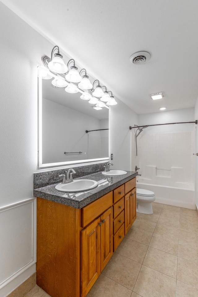 full bathroom with tile patterned flooring, vanity, bathtub / shower combination, and toilet