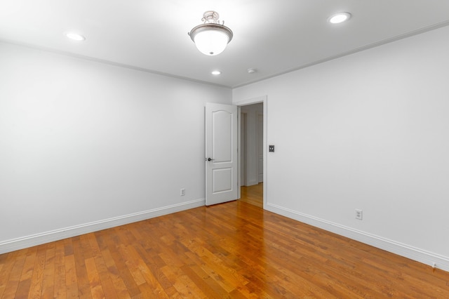 empty room with hardwood / wood-style floors