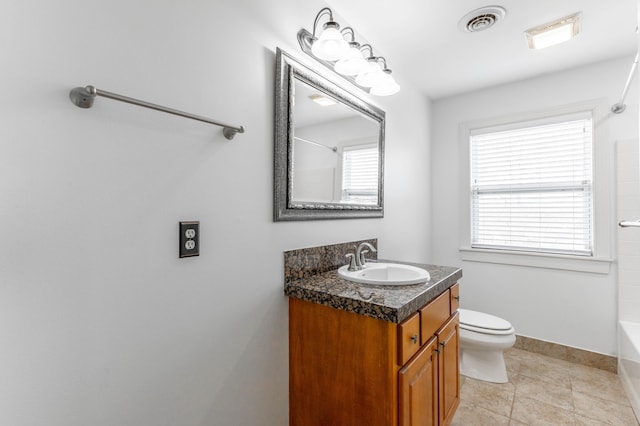 full bathroom with vanity, a wealth of natural light, tile patterned floors, and toilet