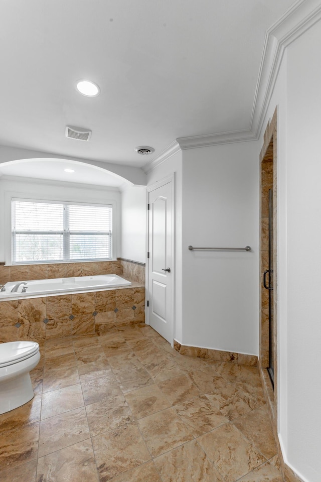 bathroom featuring an enclosed shower, crown molding, and toilet