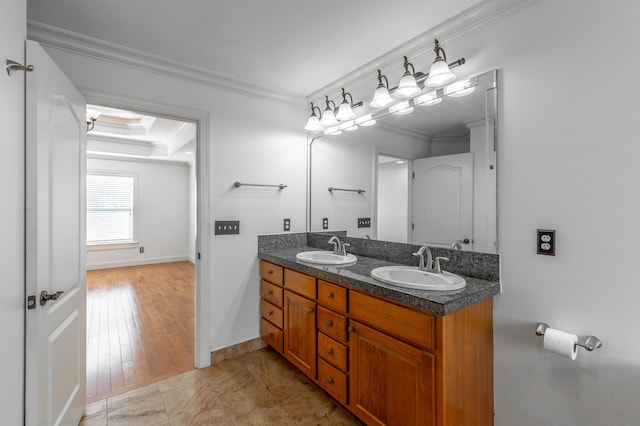 bathroom featuring vanity and ornamental molding