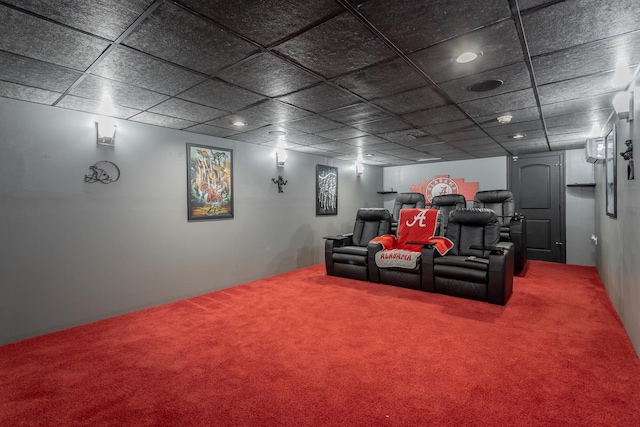 cinema featuring carpet flooring and a paneled ceiling