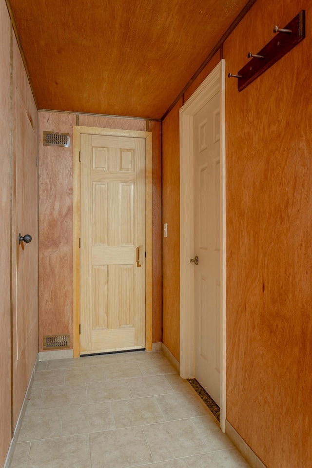 hallway featuring wooden ceiling