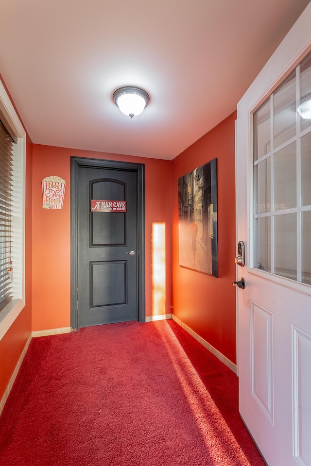 doorway featuring carpet