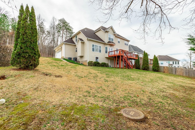 back of property featuring a yard and a deck