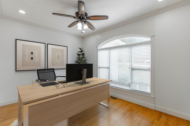 home office with ornamental molding, ceiling fan, and light hardwood / wood-style flooring