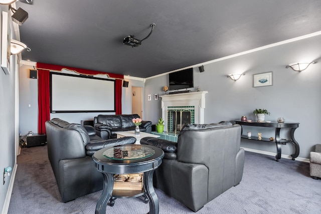 home theater featuring carpet floors and ornamental molding