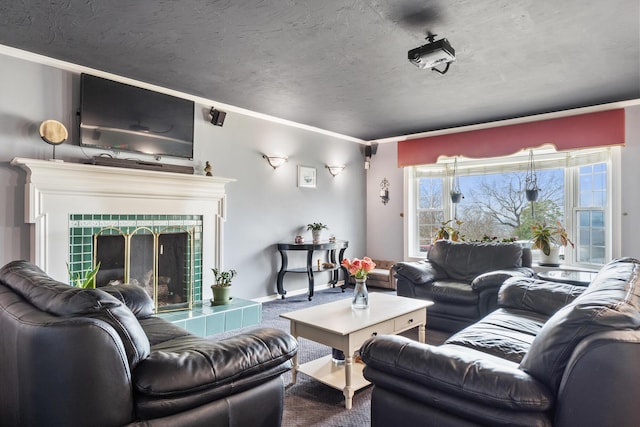 carpeted living room with crown molding, a tile fireplace, and a textured ceiling