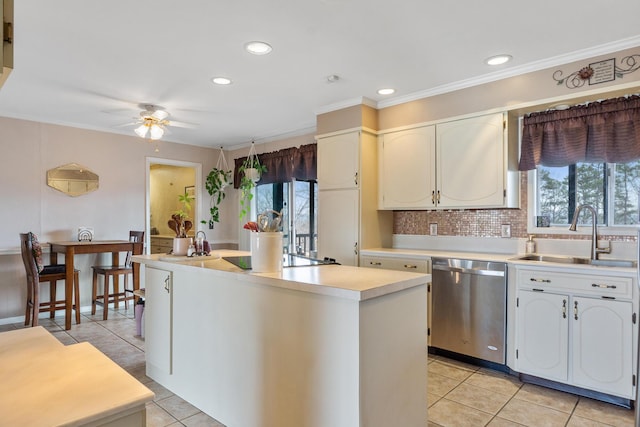 kitchen with light tile patterned flooring, tasteful backsplash, sink, a center island, and stainless steel dishwasher