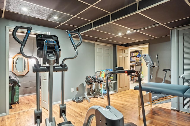 exercise area featuring hardwood / wood-style flooring