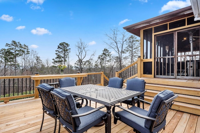 wooden deck featuring a sunroom