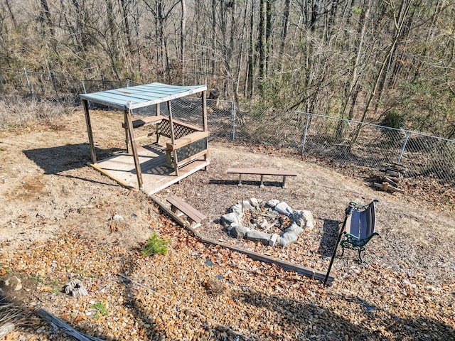 view of yard with a fire pit