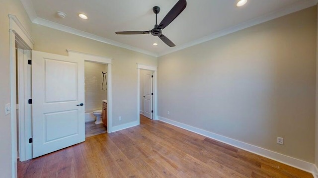 unfurnished bedroom featuring ornamental molding, connected bathroom, and light hardwood / wood-style floors