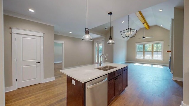 kitchen with sink, decorative light fixtures, light wood-type flooring, stainless steel dishwasher, and a kitchen island with sink