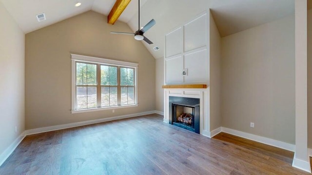 unfurnished living room with hardwood / wood-style flooring, ceiling fan, beam ceiling, and high vaulted ceiling