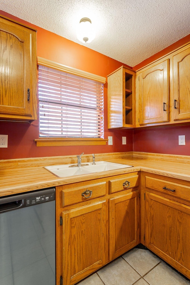 kitchen featuring open shelves, light countertops, brown cabinetry, a sink, and dishwasher