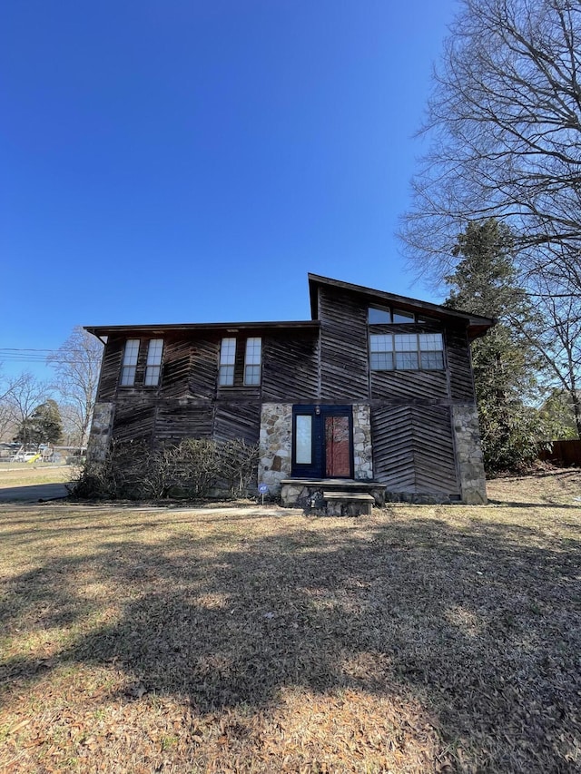 view of front of home with stone siding