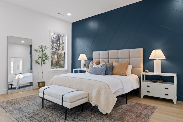 bedroom with light hardwood / wood-style flooring