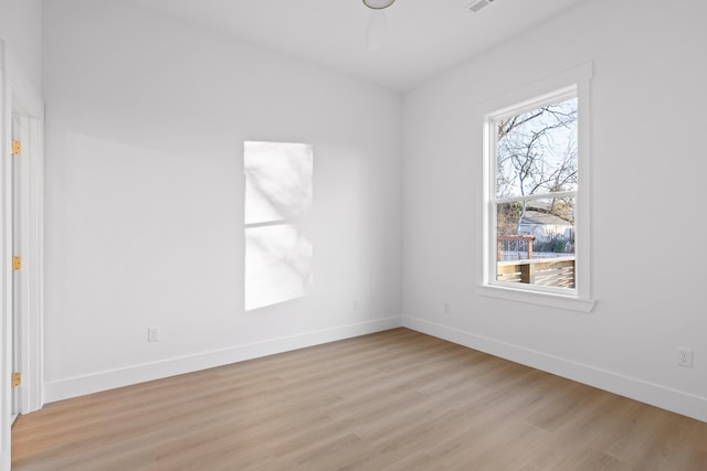 spare room with light hardwood / wood-style floors