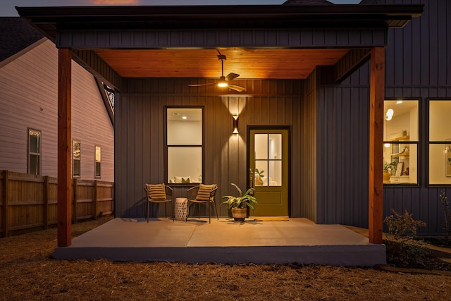 property entrance with a patio and ceiling fan