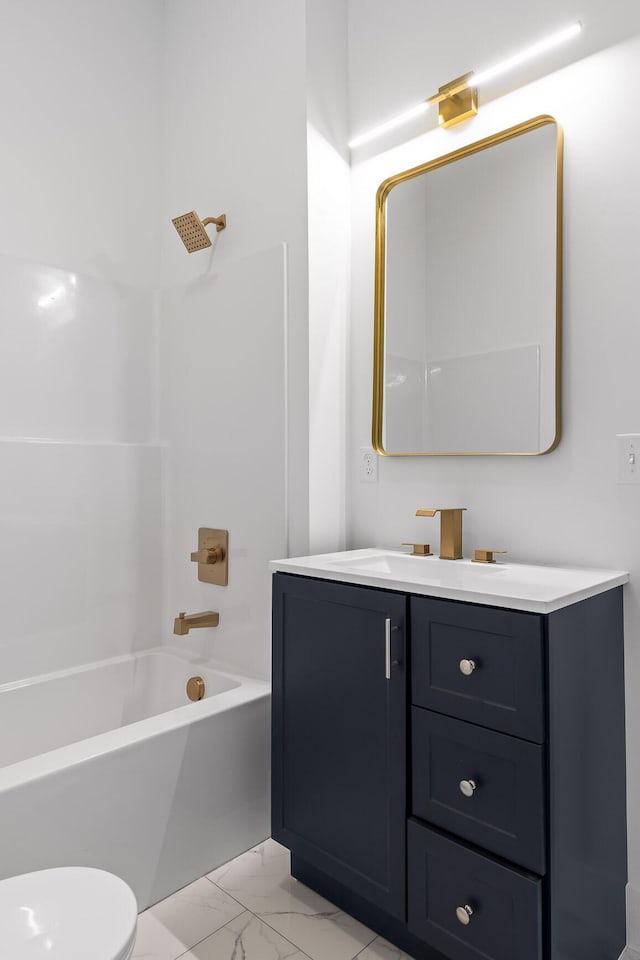 full bathroom featuring washtub / shower combination, vanity, and toilet