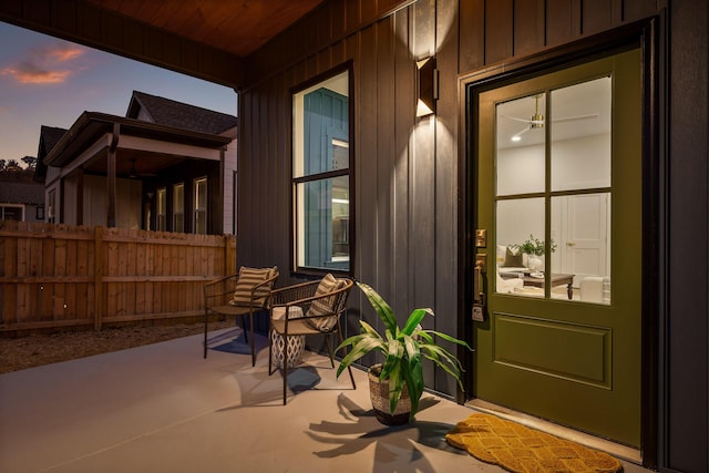 exterior entry at dusk featuring a porch