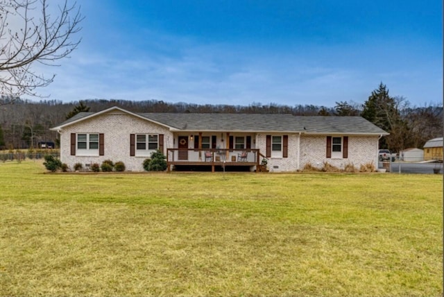 back of property featuring a yard and a deck